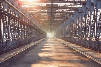Long iron bridge at sunrise