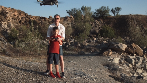 Man and Son Using Drone
