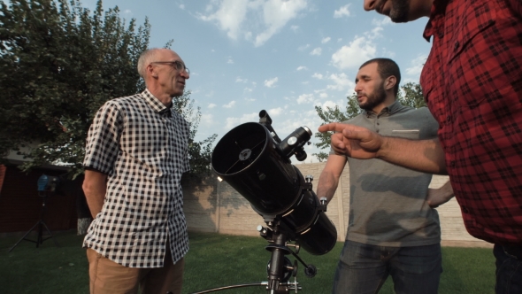 Men Watching Telescope on Backyard
