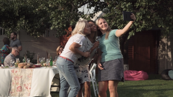 Women Talking and Taking Selfie