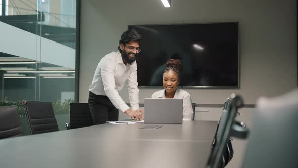 Professional Arabian Indian Teacher Mentor Helping African Woman New Employee Teaching Intern