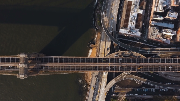 Aerial Top View of Brooklyn Bridge Through the East River and Road Junction on Manhattan Side