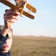The Guy Holds a Plane in His Hand Simulates Flight - VideoHive Item for Sale