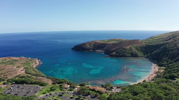 Panning aerial shot around Hanauma Bay Nature Preserve on the island of O'ahu, Hawaii. 4K