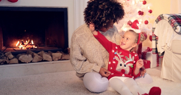 Pretty Little Girl Plays with Her Mothers Hair