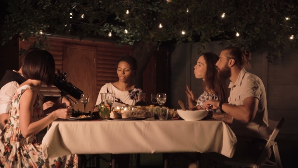 Friends Dining in Garden