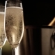 Champagne. Two Flutes with Bottle of Champagne in an Ice Bucket at Background. - VideoHive Item for Sale