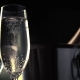 Champagne. Two Flutes with Bottle of Champagne in an Ice Bucket at Background. - VideoHive Item for Sale