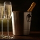 Champagne. Two Flutes with Bottle of Champagne in an Ice Bucket at Background. - VideoHive Item for Sale