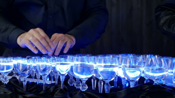 Musical Glasses. Musician Playing On Glass Harp