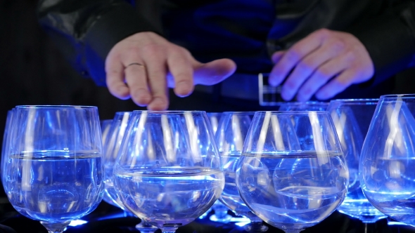 Musical Glasses. Musician Playing On Glass Harp