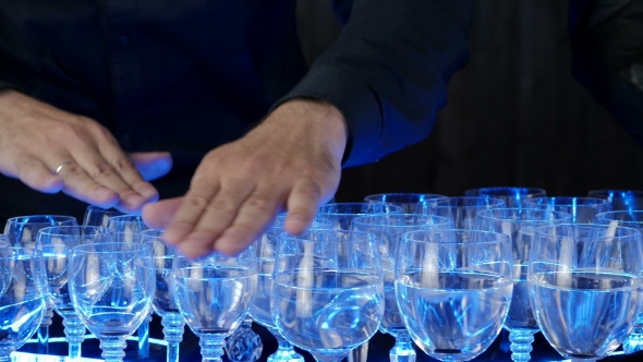 Musical Glasses. Musician Playing On Glass Harp