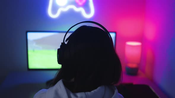 Girl playing shooter online video game - Technology trend concept