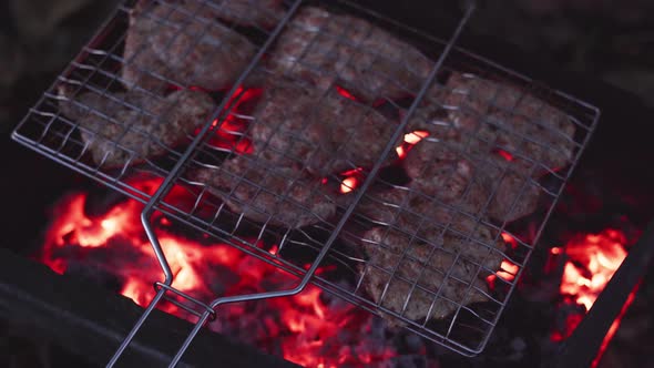 Cooking Pork Shish Kebab in a Grid on Charcoal Grill