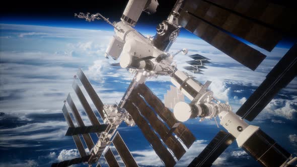 International Space Station in Outer Space Over the Planet Earth alt