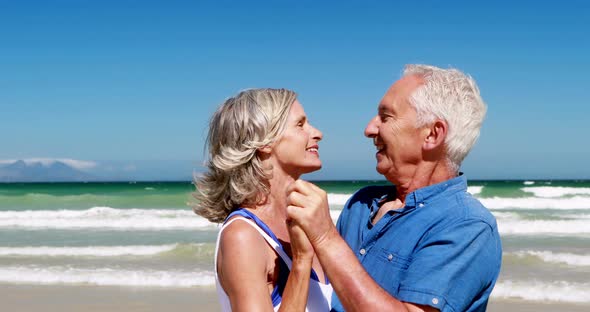 Senior couple enjoying together at the beach