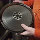 A man opens an old metal round box with an old film strip inside - VideoHive Item for Sale