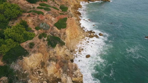 Aerial. Flying Along the Shore of Beach Rocks Arrifes, Albufeira. Portugal