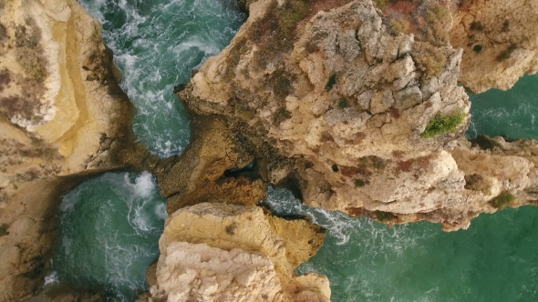 Aerial. Flying Along the Shore of Beach Rocks Arrifes, Albufeira. Portugal