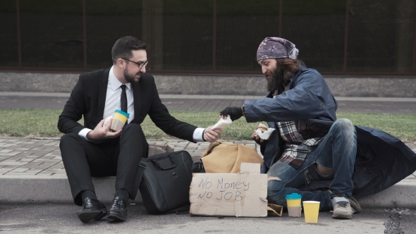 Businessman Sharing Food To Homeless