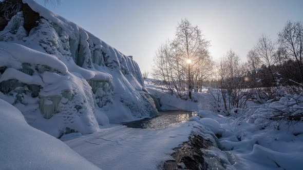 Beautiful Winter Landscape the Movement of the Sun Through a Tree in Winter a Frozen Waterfall Time