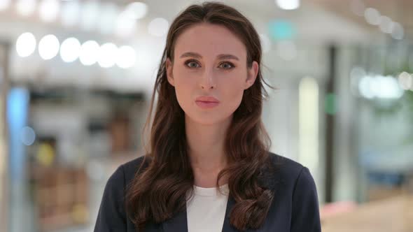 Portrait of Assertive Businesswoman Showing Stop Sign 