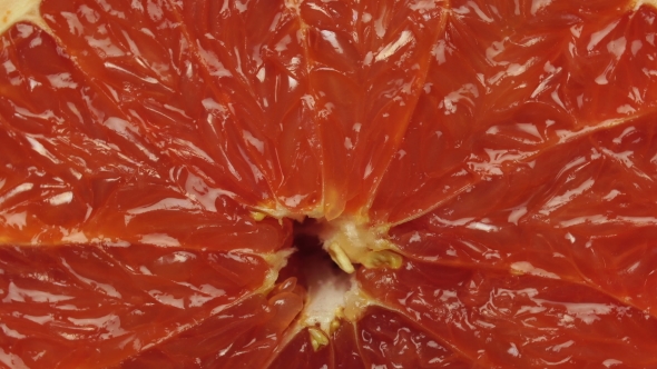 Ripe Grapefruit. Red Color Citrus Fruit, Rotates Around the Axis
