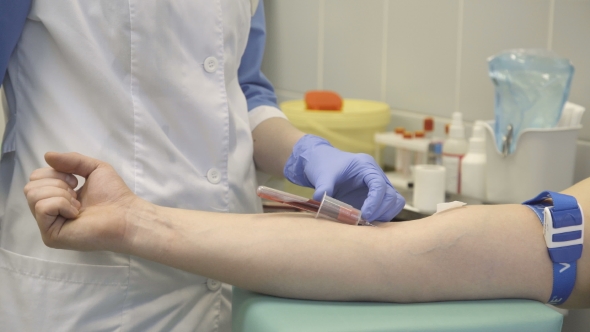 Nurse Takes Blood Samples From Patient
