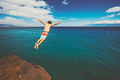 Friends cliff jumping into the ocean - PhotoDune Item for Sale