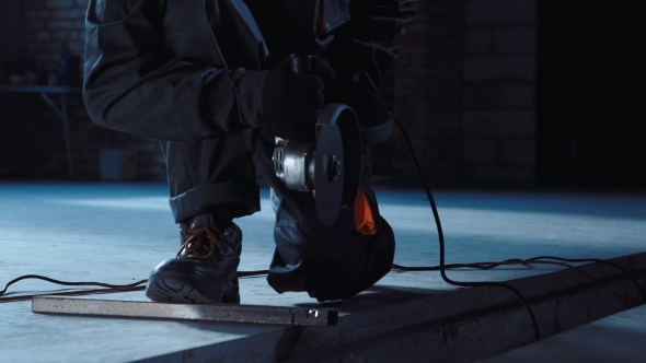 Man Preparing Angle Grinder Work Area