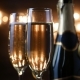 Two Flutes with Sparkling Wine over Holiday Bokeh Blinking Background - VideoHive Item for Sale