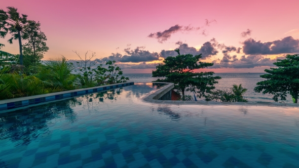 Beautiful Tropic  Sunset Over Infinity Pool in Bali