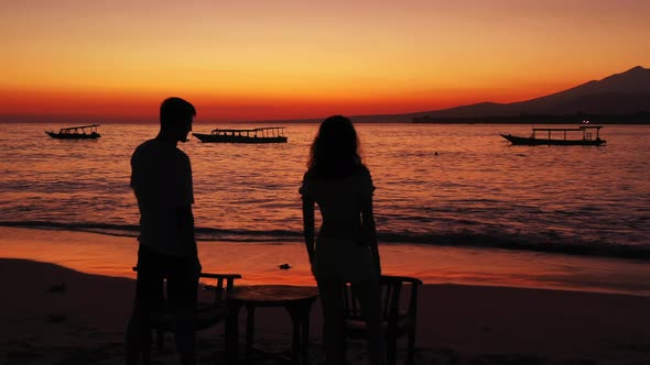 Beautiful couple on romantic honeymoon have fun on beach on clean white sand 4K background