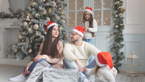 Portrait of Happy Family in Santa Hats