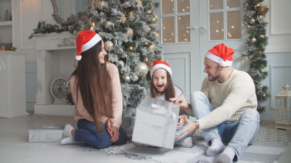 Cute Girl Gets Christmas Gift From Parents