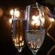 Two Flutes with Sparkling Wine Over Holiday Bokeh Blinking Background. Ultra  Footage. - VideoHive Item for Sale