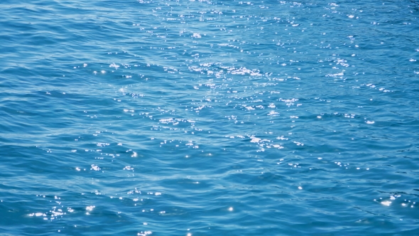  Sun's Rays Are Reflected on the Surface of the Water