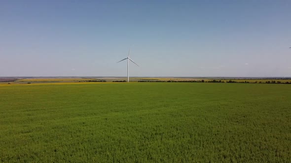 Aerial drone view of a flying over the wind turbine