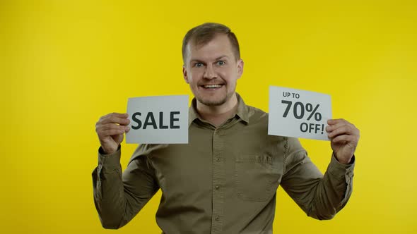 Joyful Man Showing Sale Word and Showing Up To 70 Percent Off Inscription, Black Friday Concept