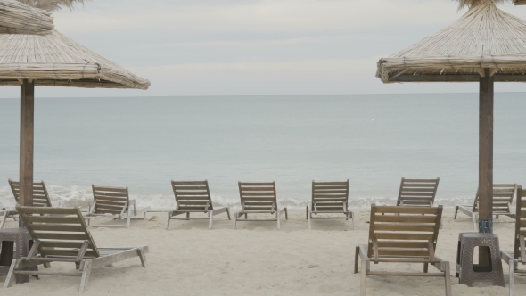 Sunbeds and Umbrellas Next To the Beach