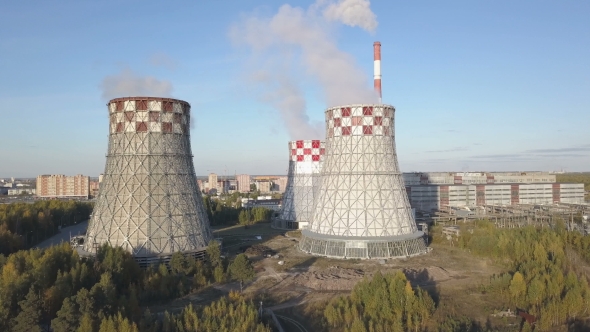 Flying Over the Plant Producing Thermal Energy with Large Pipes. Aerial Shot