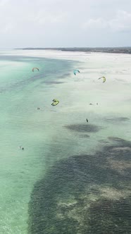 Vertical Video Kitesurfing Near the Shore of Zanzibar Tanzania