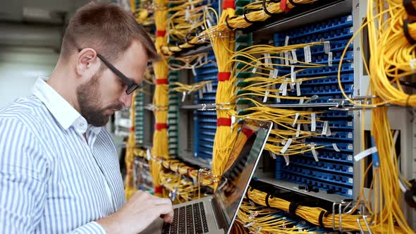 Engineer Working in Data Room