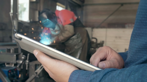 The Engineer on Manufacture with a Tablet