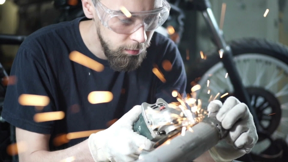 Mechanic Works with Metal Sparks