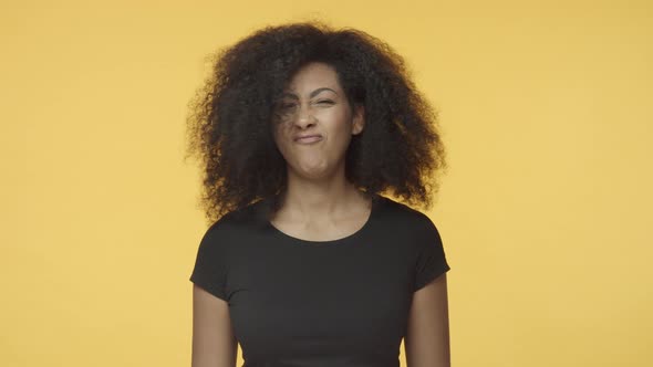 Reluctant Attractive Modern Adult Africanamerican Woman with Afro Hair Shaking Head in Negative