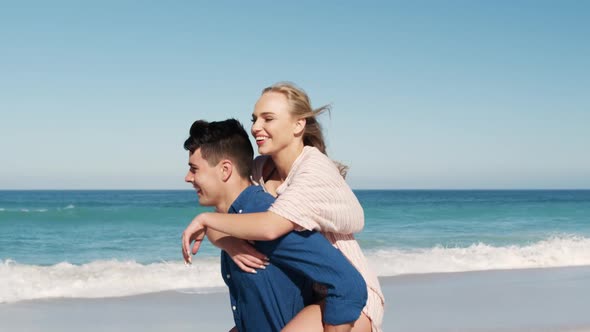 Couple in love enjoying free time on the beach together