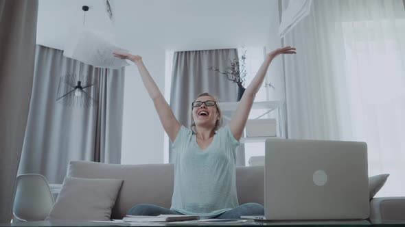 Happy Business Woman Throwing Papers Document in the Air at Home