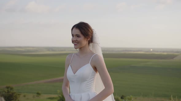 Smiling Bride in White Dress Slow Wind