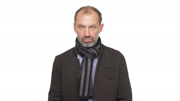 Portrait of Mature Unshaved Man with Short Hair Wearing Casual Clothes Shaking Head Negatively